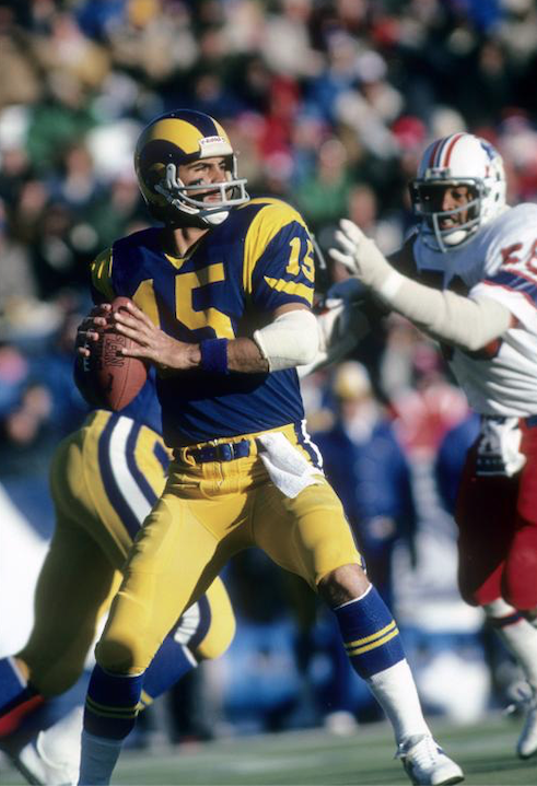 A football player is looking to pass the ball.