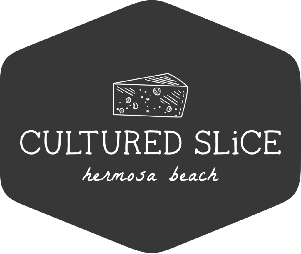 A black and white logo of a slice of cheese.