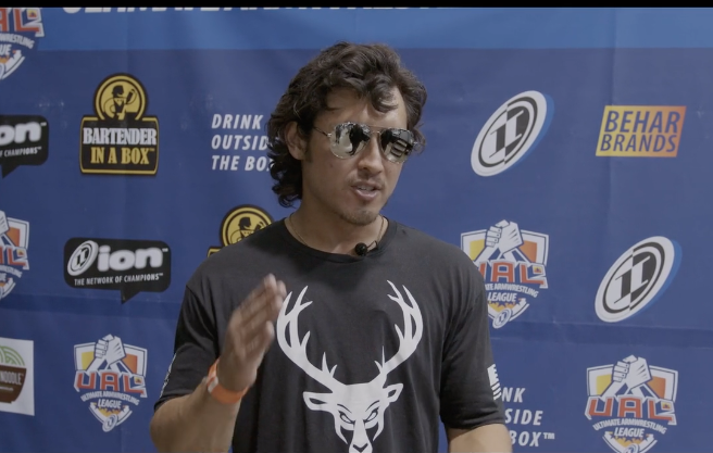 A man wearing sunglasses and a black shirt
